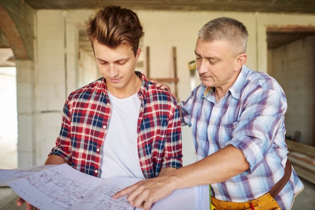 How to Protect Old Blueprints by Turning Them Into Digital Files 1 young carpenter working with an experienced man